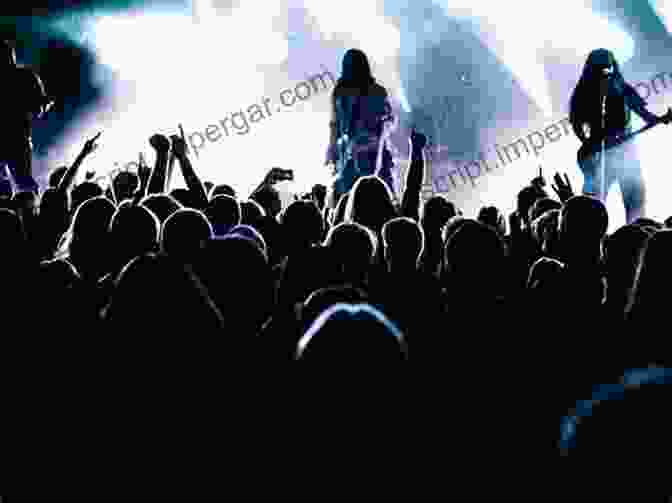 A Crowd Of People At A Hair Metal Concert, With The Band Performing On Stage. The Rise Fall And Rebirth Of Hair Metal