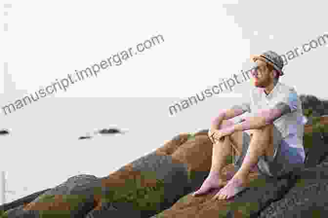 A Man Sitting On A Rock, Looking Out At The Ocean. Don T You Fall Now Christopher Burris